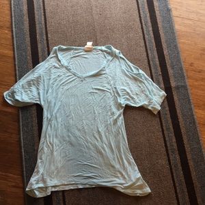 Short sleeve shirt with shoulder cut outs